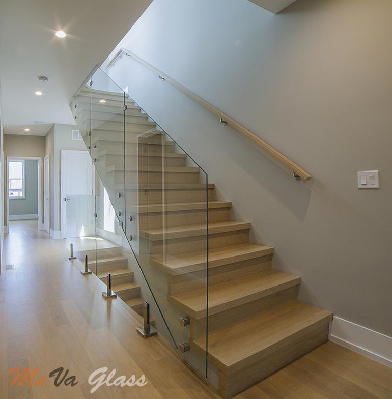 Glass beside a wood staircase