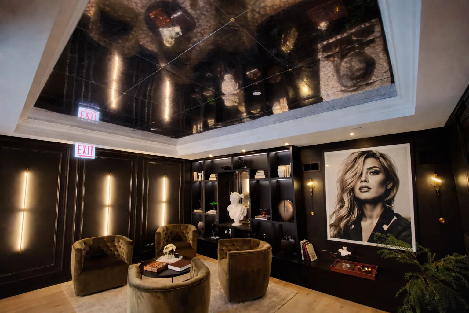 Reflective ceiling panels above a lounge with dark wood walls, portrait artwork and upholstered chairs.